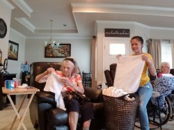 Helping us fold towels